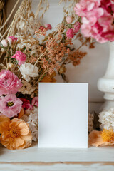 a white sheet of paper for writing on a background of flowers