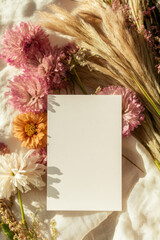 a white sheet of paper for writing on a background of flowers