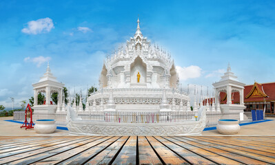 The white pagoda of Prajna Temple in Xishuangbanna, Yunnan, China.