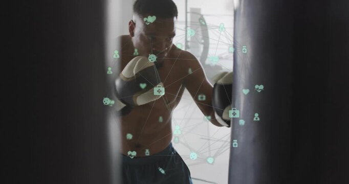 Boxer holding guard stance and initiating jab combo in gym tracking performance with network icons