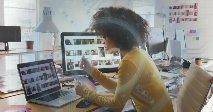 Animation of 6g text on scanner over african american female graphic designer holding color swatch