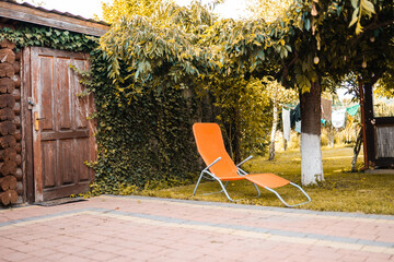 Garden chair at a swimming pool on a hot summer day.
