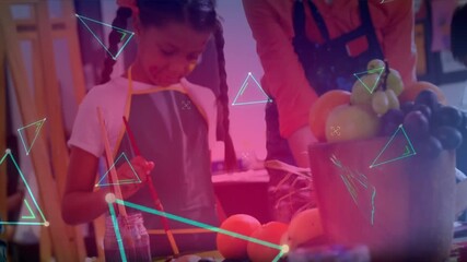 Neon triangle shapes floating against african american girl painting at elementary school