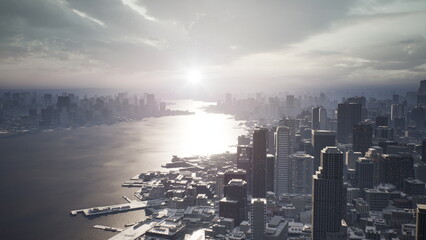 Early morning light reflects off the calm water, casting a beautiful glow on the city skyline. Tall...