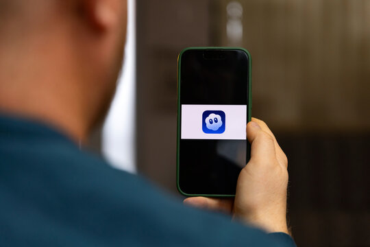 iPhone display with The Sora app (OpenAI) logo