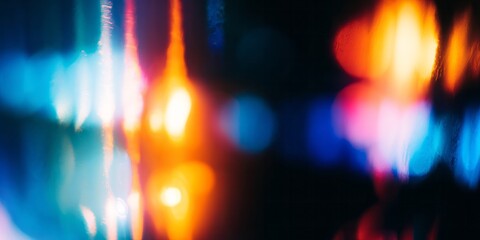 Intense vertical light streaks and glowing orbs create a dramatic abstract background of cool blues and warm oranges