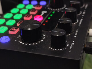 The soundcard is active with multicolored lights, photographed from close range.