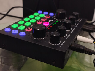 The soundcard is active with multicolored lights, photographed from close range.