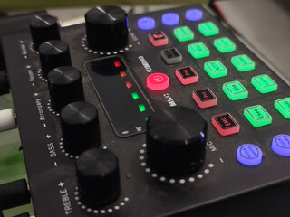 The soundcard is active with multicolored lights, photographed from close range.