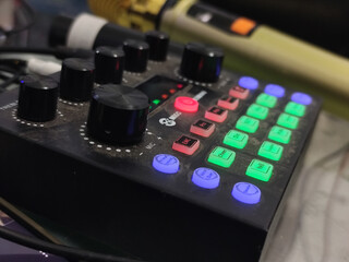 The soundcard is active with multicolored lights, photographed from close range.