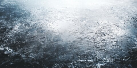 Textured, icy surface reflects bright light across a frozen expanse