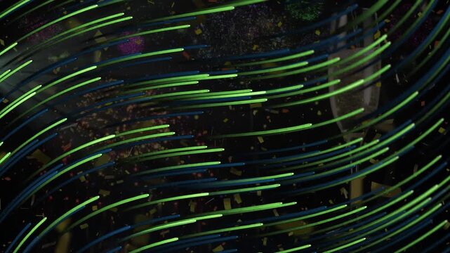 Animation of shapes and confetti over glass of champagne