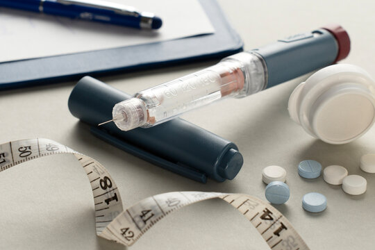 Diabetes Management with Insulin Pen, Medication, and Measuring Tape
