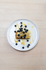 Banana and blueberry on a toast with honey drizzle.