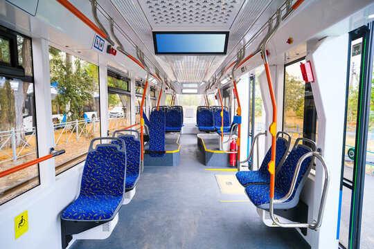 Inside a new modern city tram or bus. Urban public transport.