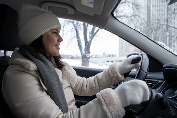 Smiling Woman Driving in Winter Weather