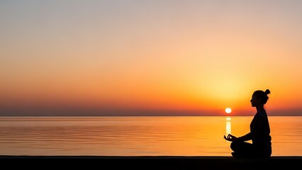 Obraz premium Woman practicing yoga meditation at sunset by calm ocean water with golden sky reflection creating peaceful mindfulness moment for wellness and relaxation.