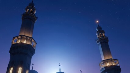 Naklejka premium Two illuminated mosque minarets against a clear blue night sky with scattered stars and a subtle glow at the base