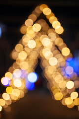 Fototapeta premium Blurred Golden Christmas Tree Lights Bokeh Background