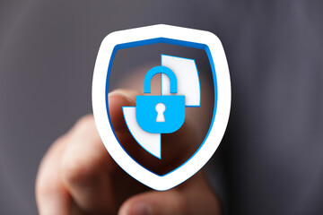 Concept of online security and data protection. Person pointing to a shield with a padlock, symbolizing safe browsing and cyber defen