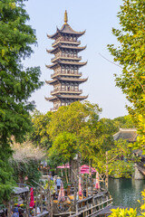 Cafe and pagoda at the canal in Wuzhen, China