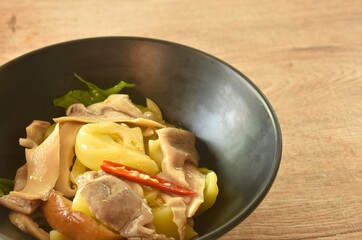 stir fried pickled cabbage with slice pork stomach and chili on bowl