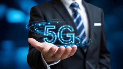 Businessperson holding glowing 5G hologram symbolizing advanced connectivity and digital transformation