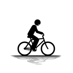 Obraz premium Cyclist riding a bicycle on a road with a shadow reflection on the ground below