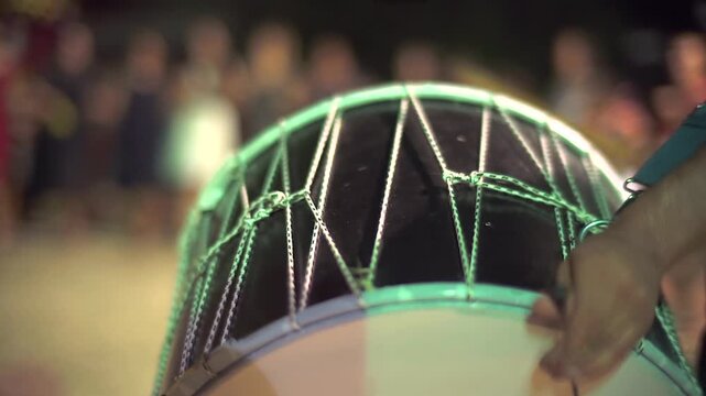 Traditional halay dance performed at ethnic wedding with drum duduk music and joyful crowd. Regional folk celebration shows circle dancers rhythm energy across Middle East cultures.