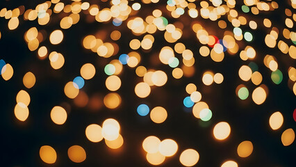Aerial view of vibrant city lights at dusk with blurred bokeh effects and twinkling illuminations
