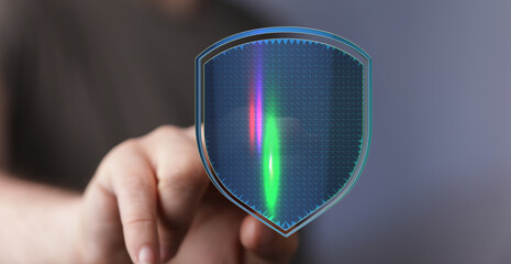 Image depicting cyber security, digital data protection with a shield, concept of privacy and internet safety. Hand touching a futuri