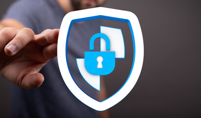 Close up shot of a hand offering a digital shield concept, symbolizing network security, privacy, and online safety. Protection from © vegefox.com