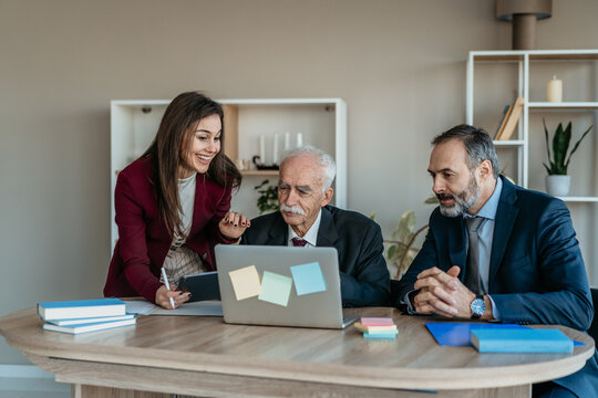 Multi-Generational Business Team Smiling Together in Modern Office &ndash; Family Business Atmosphere