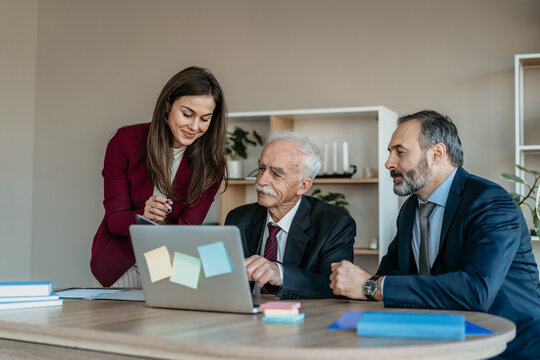 Multi-Generational Business Team Smiling Together in Modern Office &ndash; Family Business Atmosphere