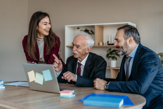 Multi-Generational Business Team Smiling Together in Modern Office &ndash; Family Business Atmosphere