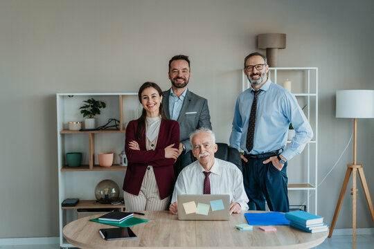 Multi-Generational Family Business Team Portrait in Modern Office &ndash; Smiling Expression