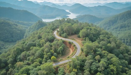 Aerial view of road in the middle of forest.Road curve construction up to mountain.Healthy environment concept and rainforest ecosystem.     




