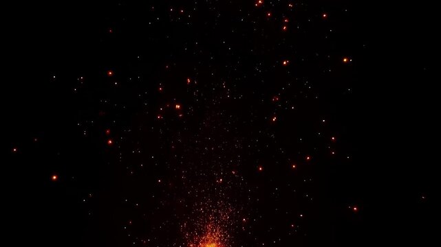 Sparks from the fire fly upward in dramatic abstract style in black and orange colors representing heat energy and glowing embers on dark background