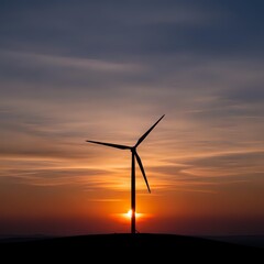 Obraz premium Wind turbine silhouette against dramatic sunset sky with orange and purple clouds. Renewable energy concept for sustainable power generation and environmental projects.