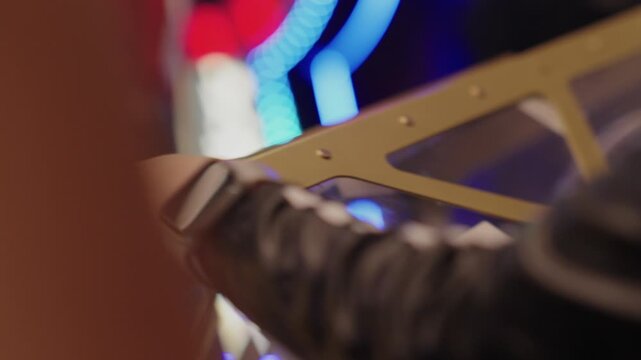 A lottery drum with numbers. The process of drawing prizes, extracting winning numbers, a lottery drum with bingo. A fortune lottery drum for determining the winner. Luck and fortune. A woman's hands 