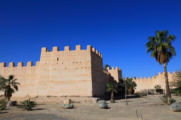 Ramparts and palm trees in Taroudant city, Morocco.