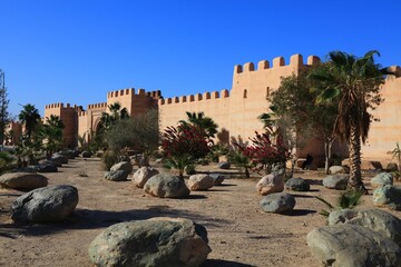 Ramparts and palm trees in Taroudant city, Morocco.