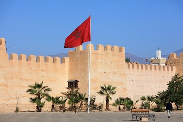 Ramparts and Moroccan flag in Taroudant city, Morocco.