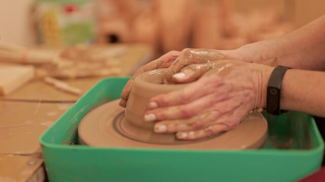 A potter makes a new clay vessel from clay. Pottery. The craft of throwing clay on a potter's wheel.