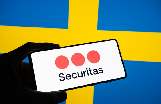 Securitas logo on smartphone infront of the Swedish flag. Link&ouml;ping, &Ouml;sterg&ouml;tland, Sweden. 01-15-2025.