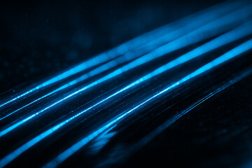 Three sleek cyan arc beams curving rightward, like streamlined motion trails in a dark tunnel