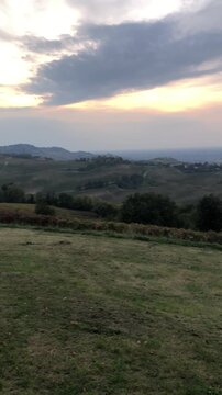 Short Video of Beautiful Oltrep&ograve; Pavese Hills from Cigognola Village during a Colorful Sunset in a Cloudy Autumnal Day. Pavia Province, Italy