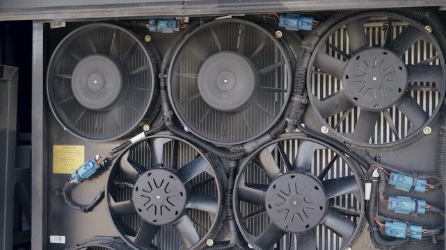 Explore how the bus engine cooling system works, featuring close-up views of the components in action. Witness key elements that help regulate engine temperature and prevent overheating.