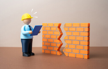 An engineer encounters a breach in a wall. Structural damage to the architecture. Safety risk concept, construction failure and urgent inspection. Engineering responsibility, repairs