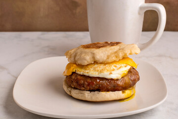 sausage egg and cheese breakfast sandwich with milk